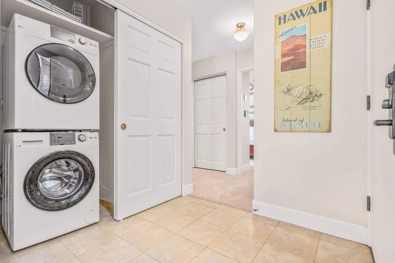 Entry hall with stacked washer and dryer