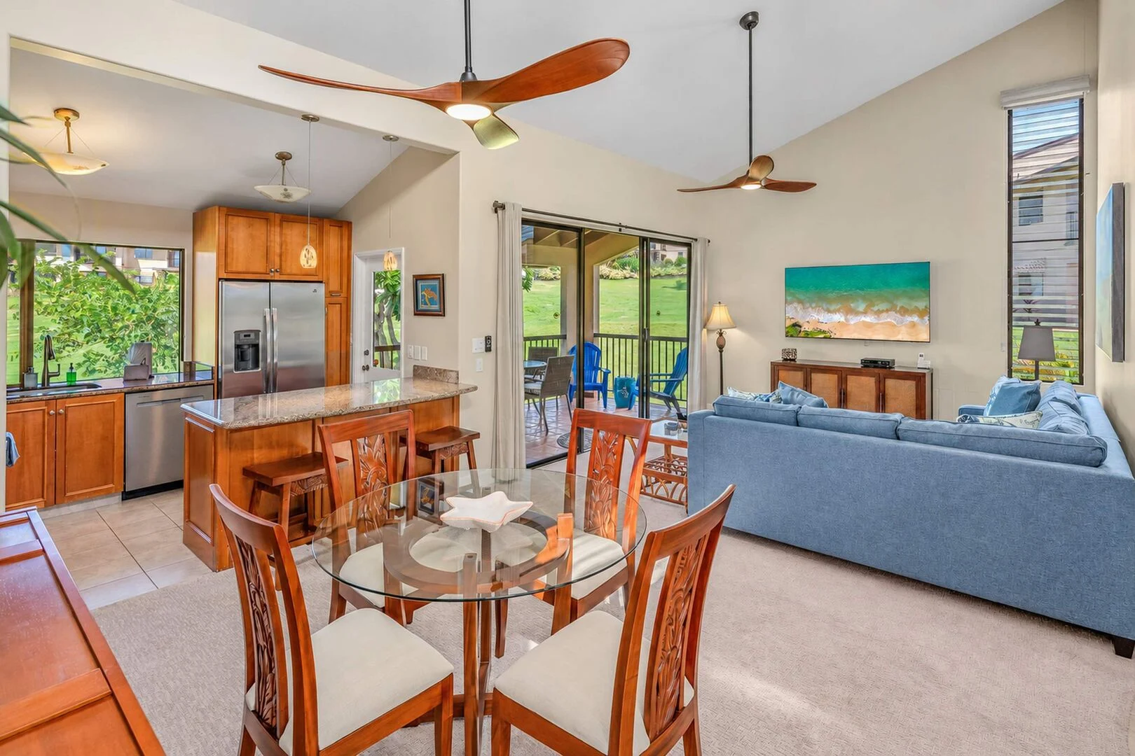 Living room at Wailea Ekahi 10F with blue sectional opening onto the lanai