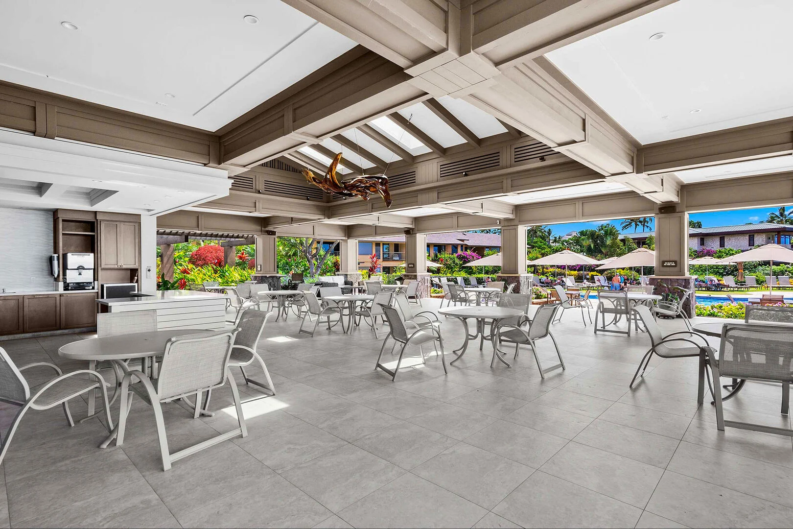 Beachfront pavilion dining area overlooking the pool