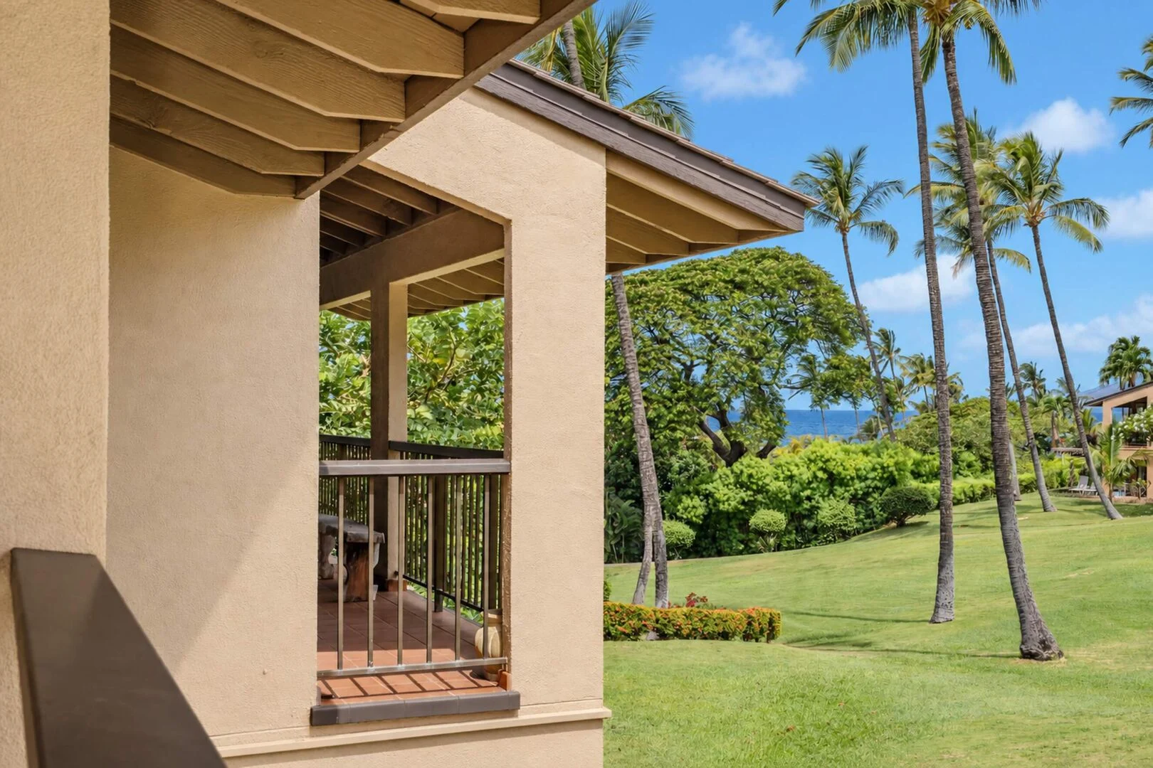 Tropical gardens, palms, and ocean views from Wailea Ekahi 10F