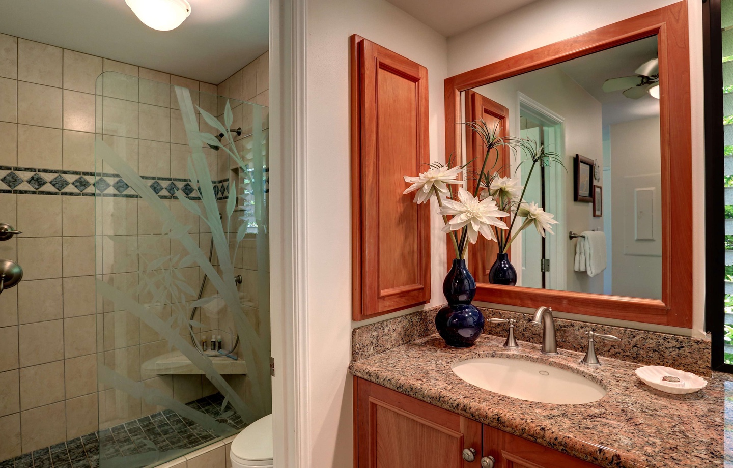 Bathroom at Wailea Ekahi 10F with walk-in glass shower and granite vanity